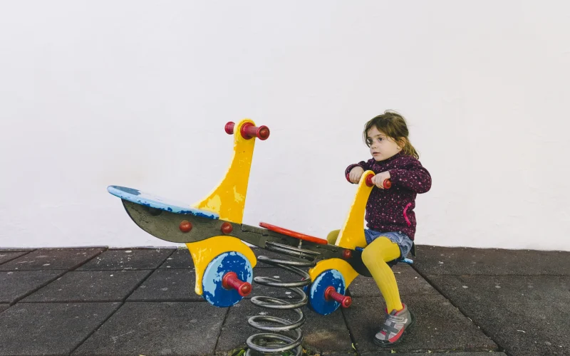 girl taking ride seesaw